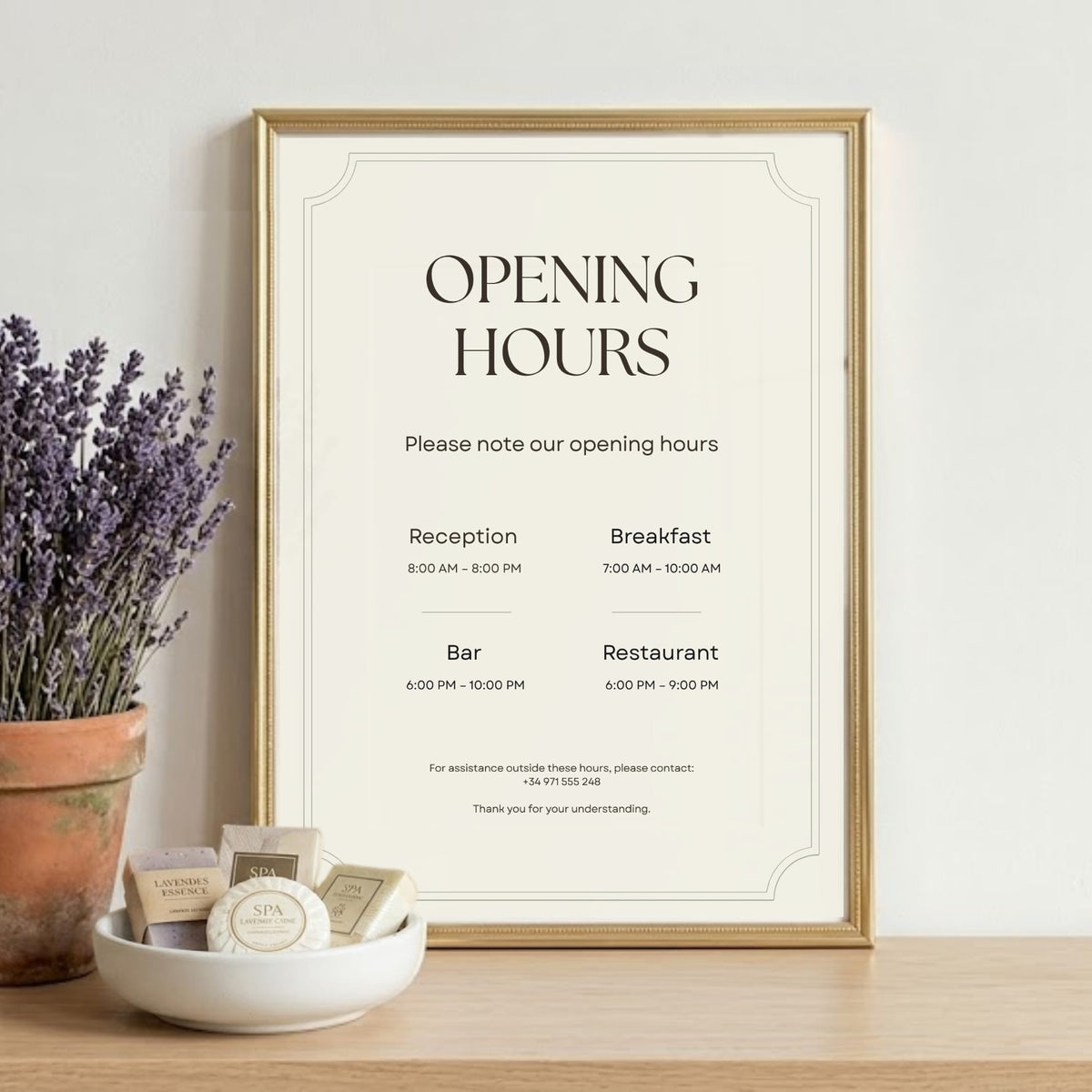 Boutique hotel opening hours sign displaying reception and guest service hours.